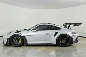 Side three-quarter view of the GT3 RS showing forged wheels and front aero surfacing