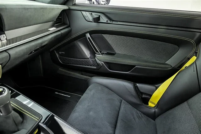 Lightweight door card with fabric pull strap and yellow belt webbing